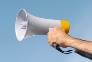 Op de foto zie je een hand die een megafoon vasthoudt. Laat je stem horen! Klik op dit blok voor meer informatie over waarom je moet stemmen. Op de foto zie je een hand die een megafoon vasthoudt. Laat je stem horen! Klik op dit blok voor meer informatie over waarom je moet stemmen.